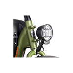 A premium headlight with a reflector mounted on a green Ebike