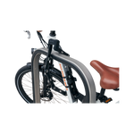 Side view of ABUS Bordo Granit X-Plus 6500 Folding Lock safely locking an ebike's front wheel to a bike rack.