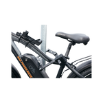 Close up side view of ABUS Bordo Granit X-Plus 6500 Folding Lock safely locking an ebike through the frame to a bike rack.