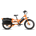 Full side view of an orange RadWagon with a fully-loaded black Ballard Cargo Bag on the rear rack.