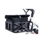 Close-up along the side of the Small Basket Roll Top Liner in the front basket of a Rad ebike. Its top is rolled up and buckled, securing it shut.