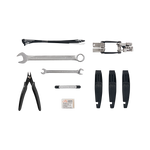 Detailed view of the tools included in the Roadside Repair Tool Kit: 18 mm Wrench, 8 / 10 mm Wrench, Flat-side Cutters, Brake Inner Pad Adjustment Tools, 3 Tire Levers, Glueless Patch Kit, and a Multi-tool featuring a #2 Philips Head Screwdriver, Flathead Screwdriver, Six Allen Wrenches, T25 Torx Wrench, Chain Tool, and Custom Rad Spoke Wrench. 