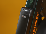 Semi-integrated safe shield battery on a ebike against a gold background