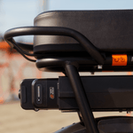 A close up of a Safe Shield battery in a range extender on a bike ebike.